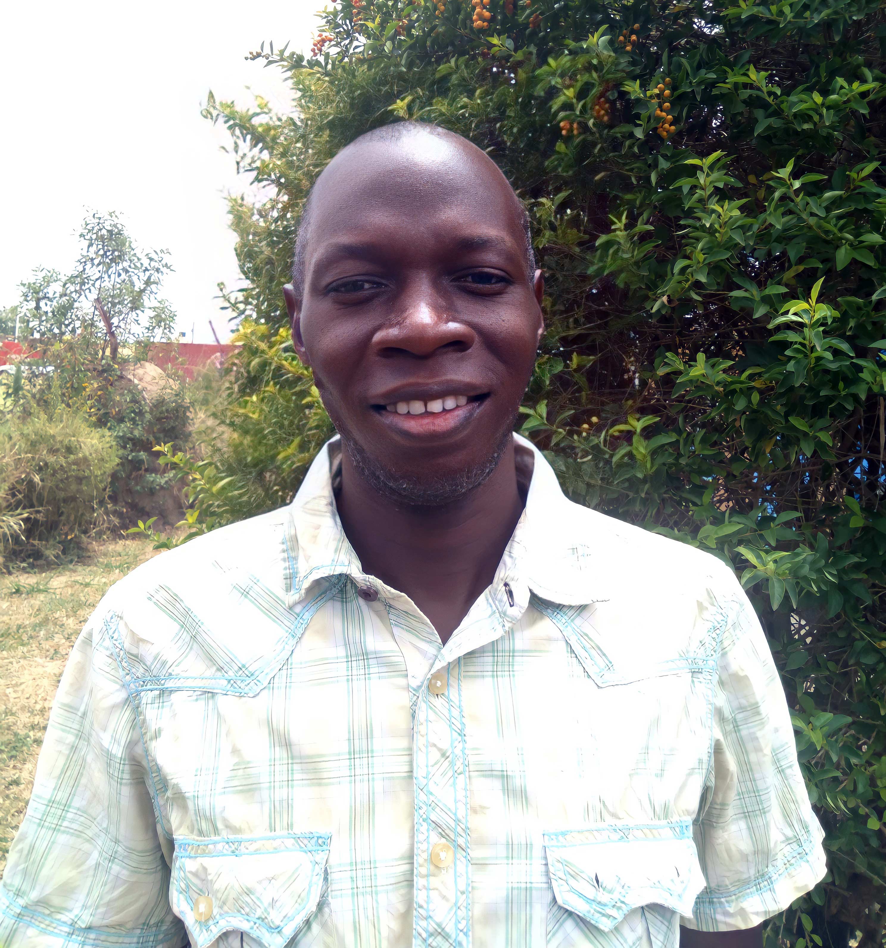 Portrait photo of Eric Erima